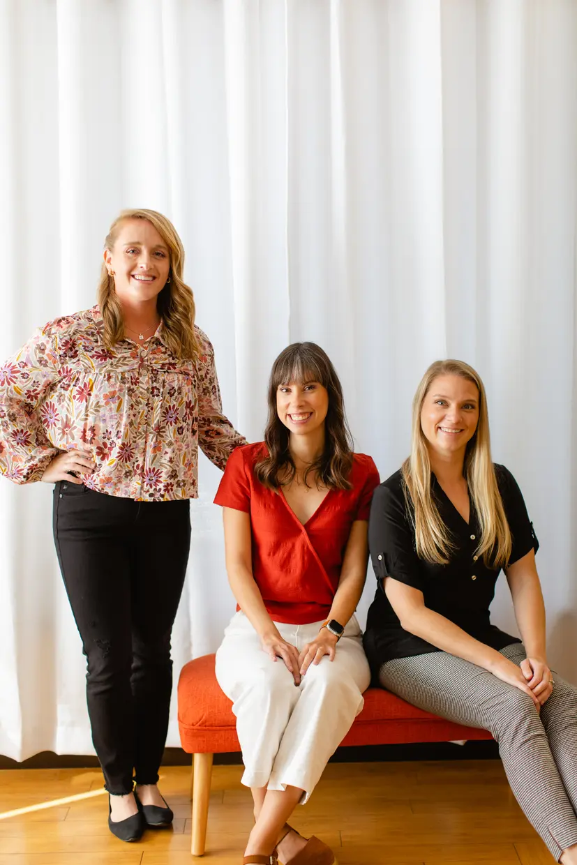 Ocean Beach Speech team members seated together at the clinic